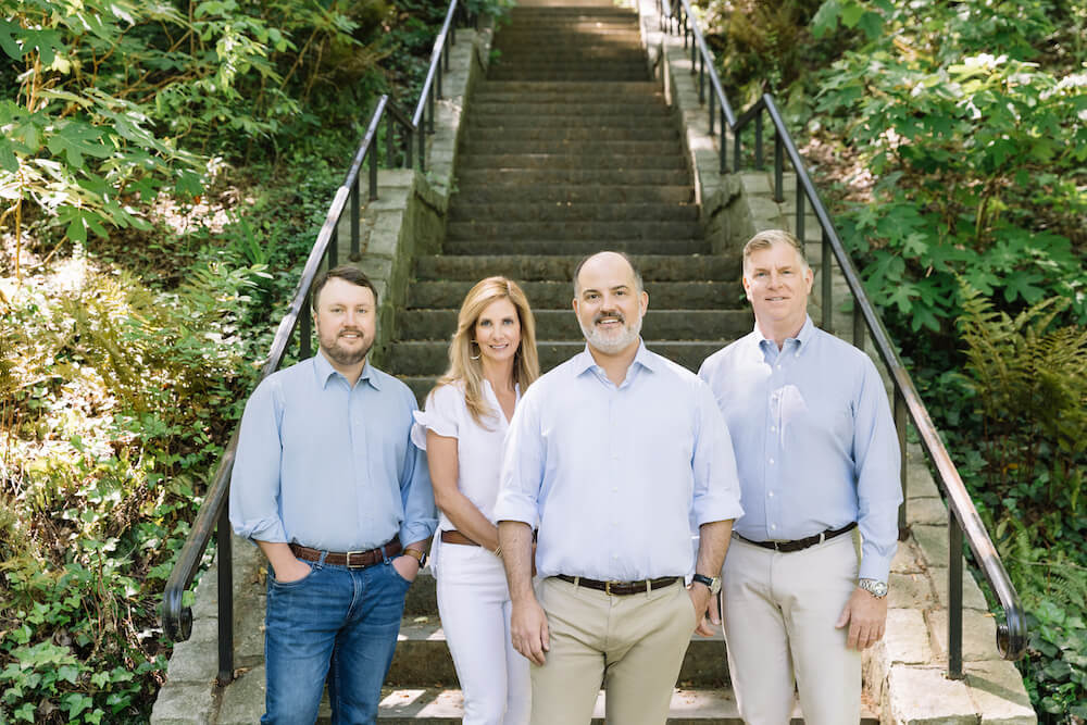 The T. Blake Segars Architecture team stand at the bottom of an outdoor stairway