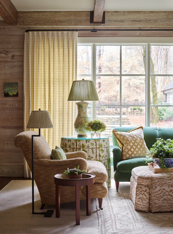 Cosy living room with view into garden. Landscape design services Atlanta