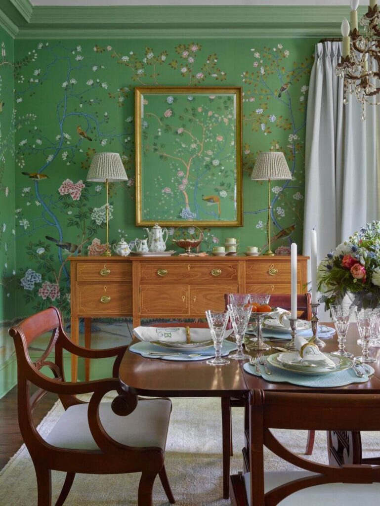 Dining room with green decorative wallpaper
