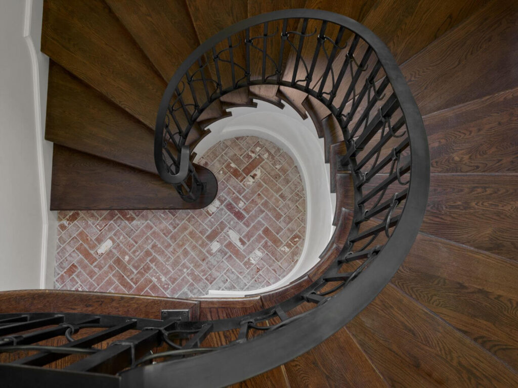 View down a winding staircase designed by T. Blake Segars Atlanta